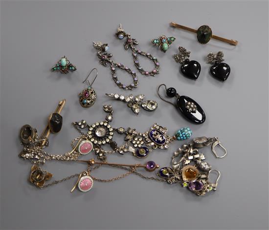 A mixed group of assorted jewellery including two scarab brooches, gem set earrings, pendants etc.